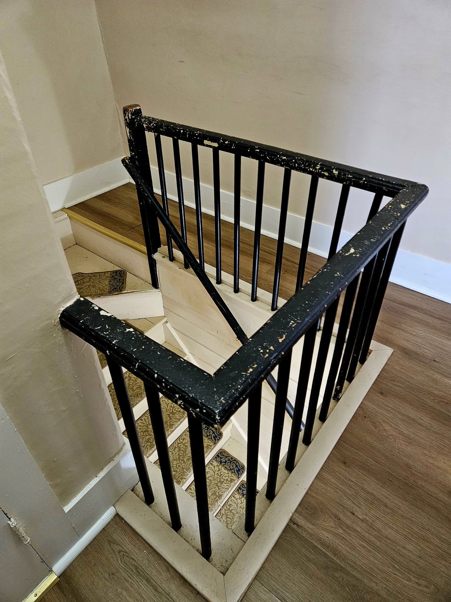 Worn wooden railing before restoration