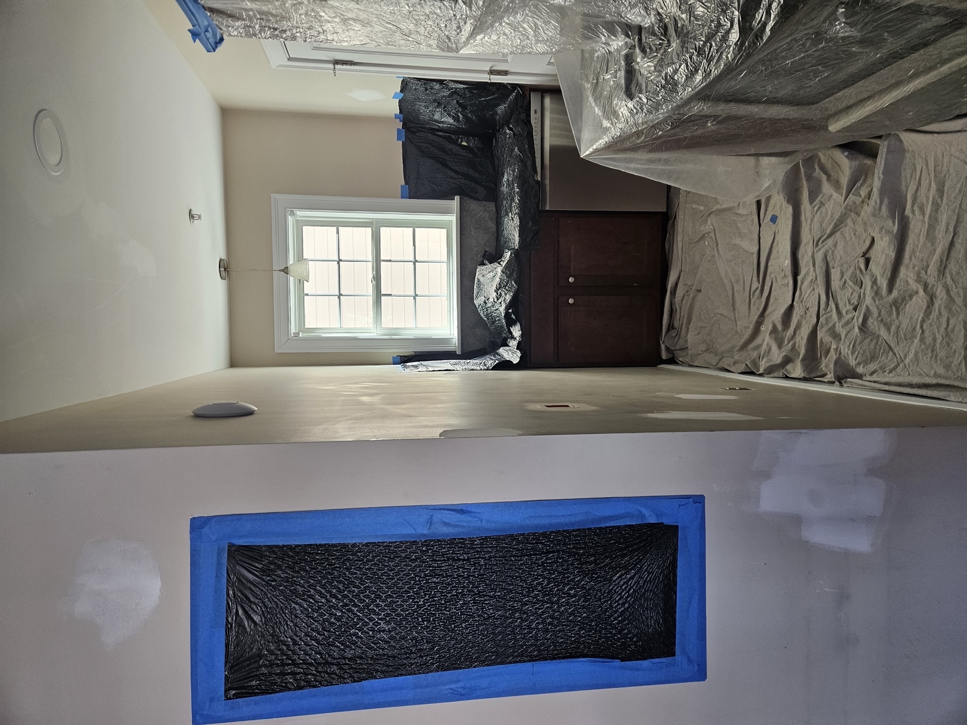 Paint preparation work — patching and priming walls before painting
