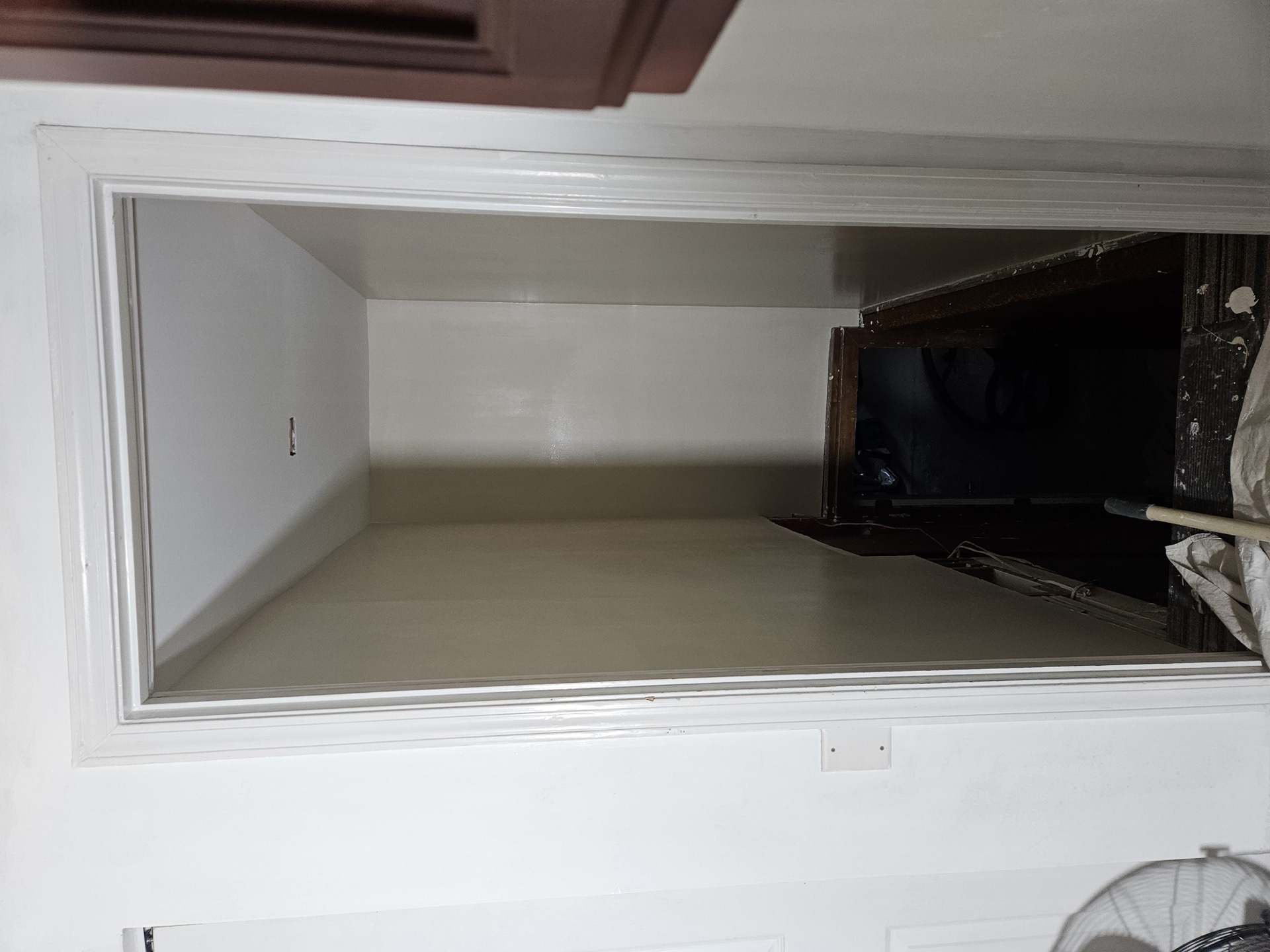 Interior staircase after refinishing with fresh paint and stain