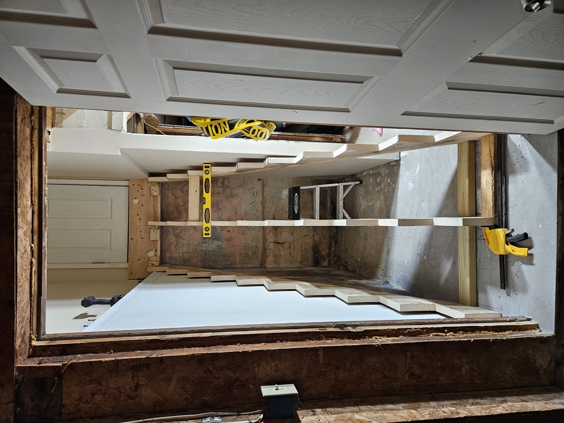 Staircase refinishing mid-project — sanded and ready for stain