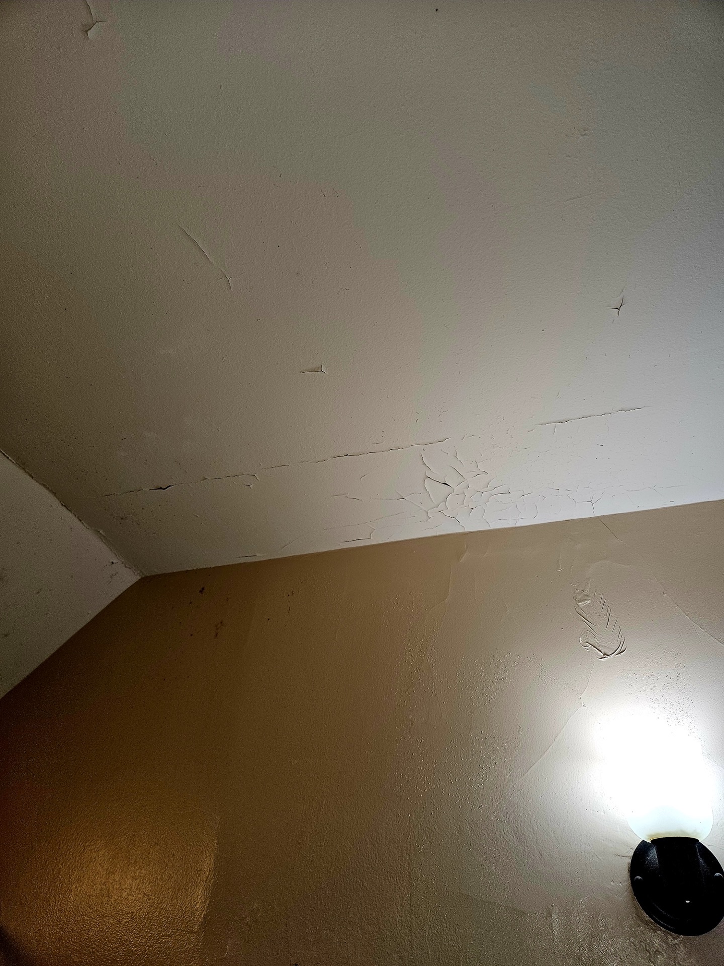 Water-stained ceiling before repair